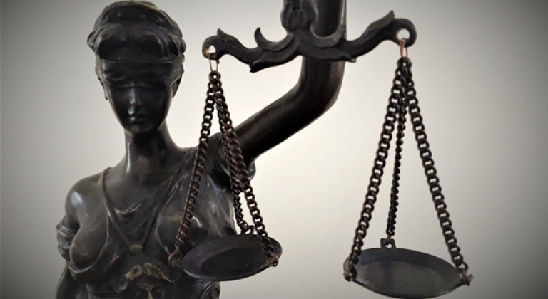 Statuette of Justice holding scales